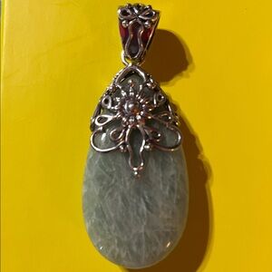 Intricate Silver and Aquamarine Gemstone Pendant